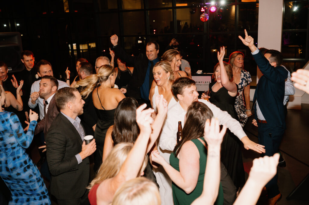 packed dance floor of guests dancing