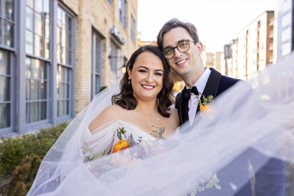 bride and groom portrait with veil 