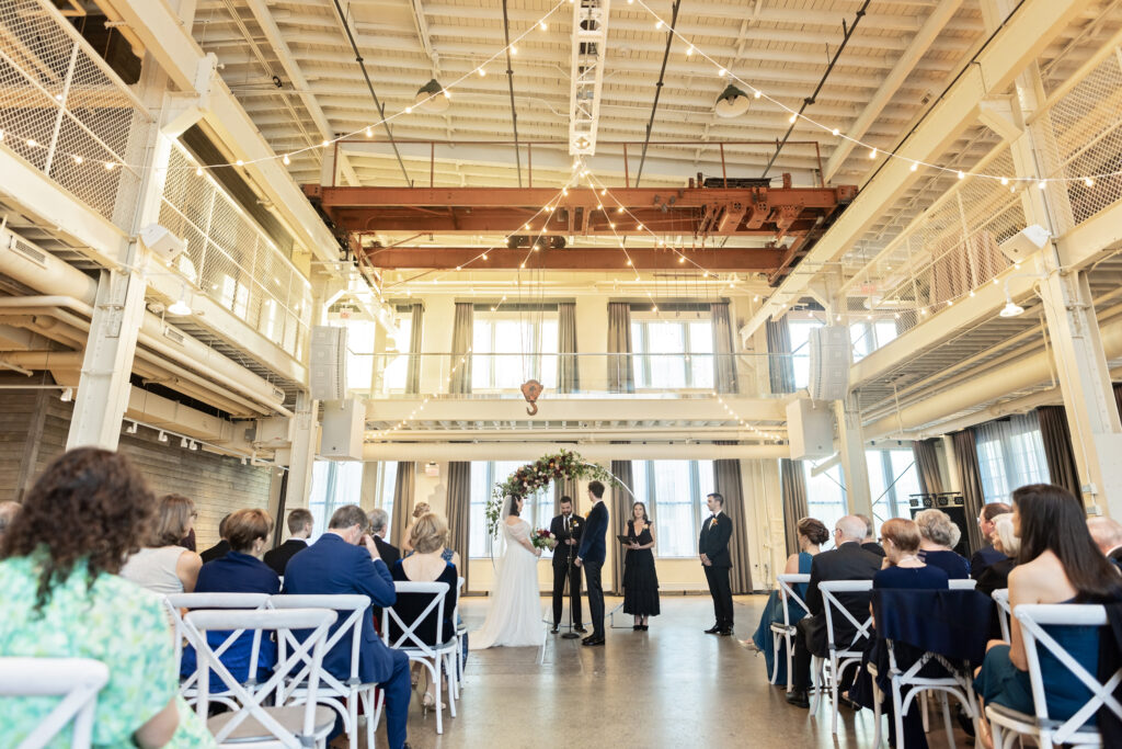 wedding ceremony at Machine Shop with string lights