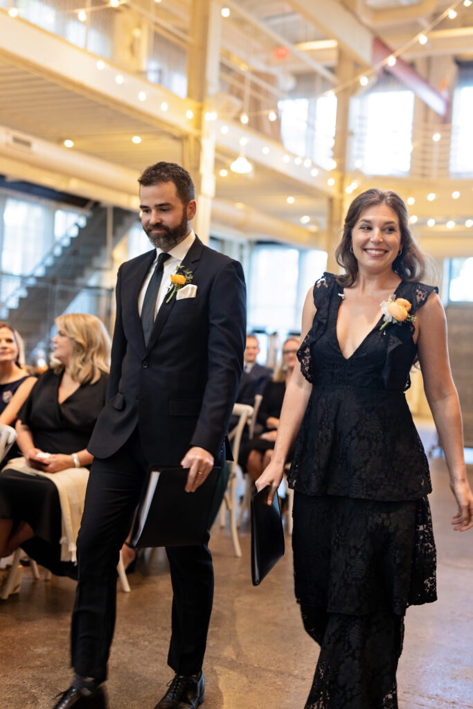 two officiants walking down the aisle for processional