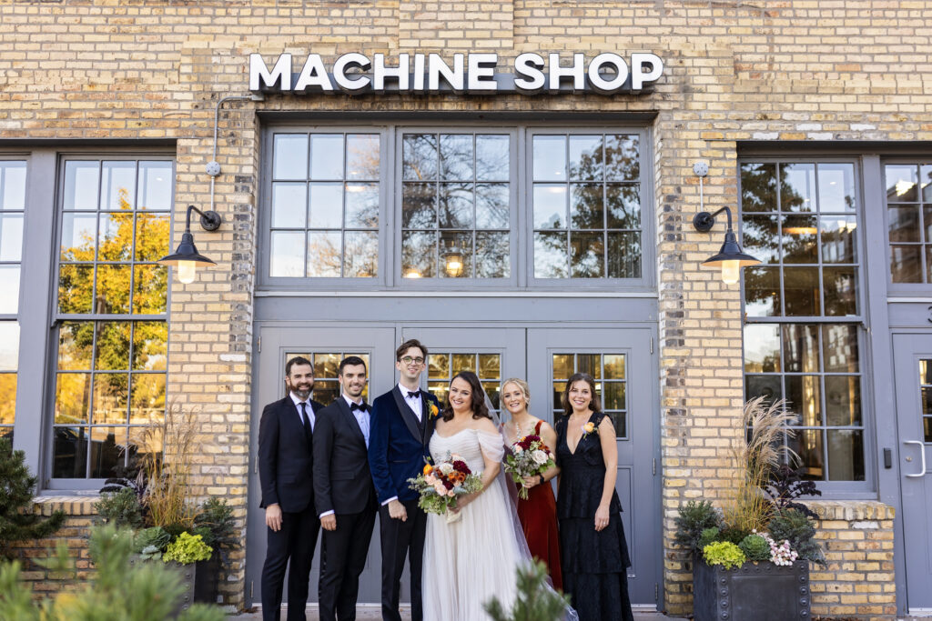 wedding party group photo outside of Machine Shop