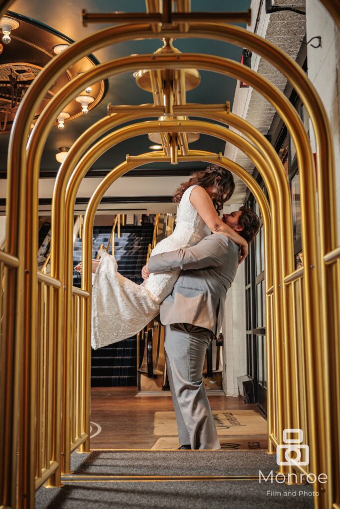 bride and groom wedding portrait with hotel luggage carts