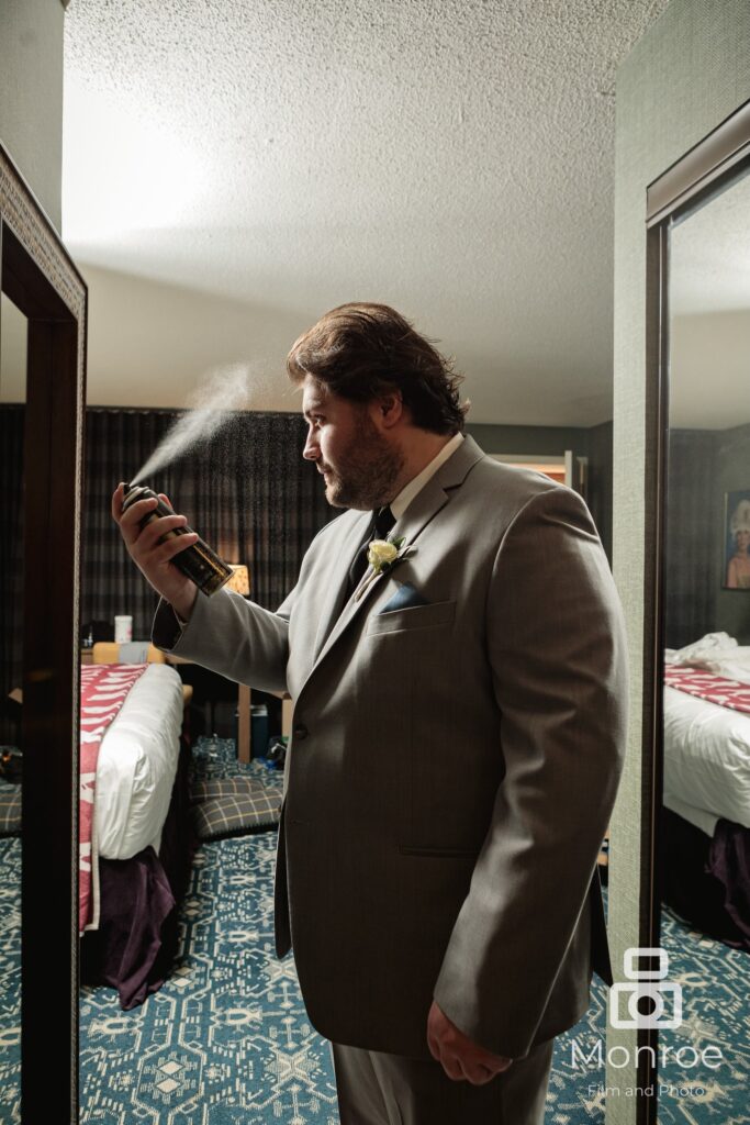 groom getting ready at graduate hotel