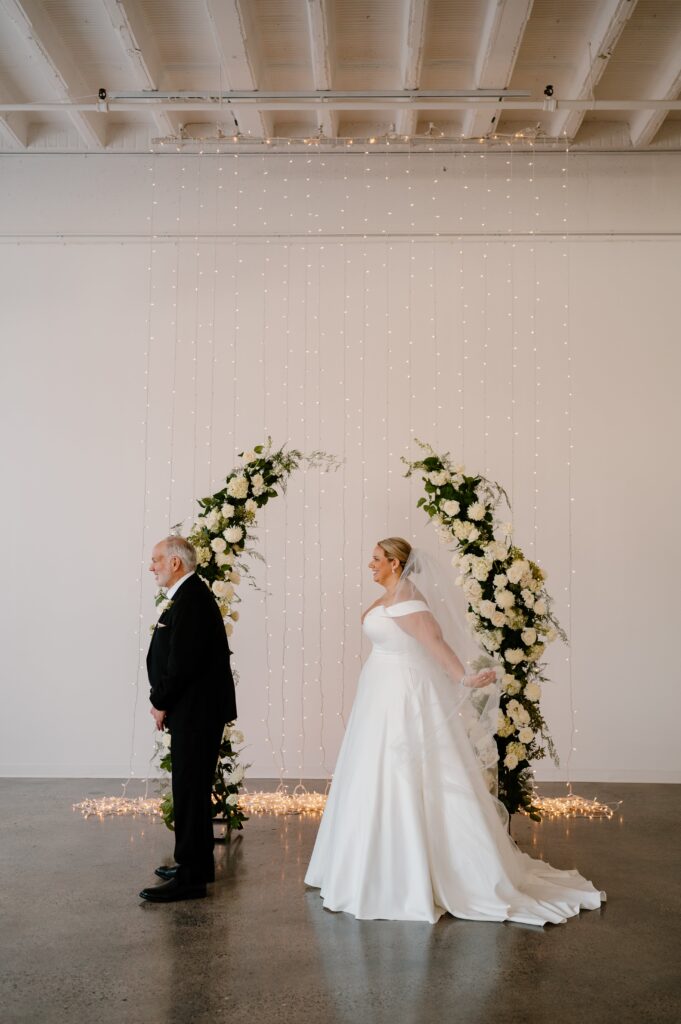 bride first look with dad