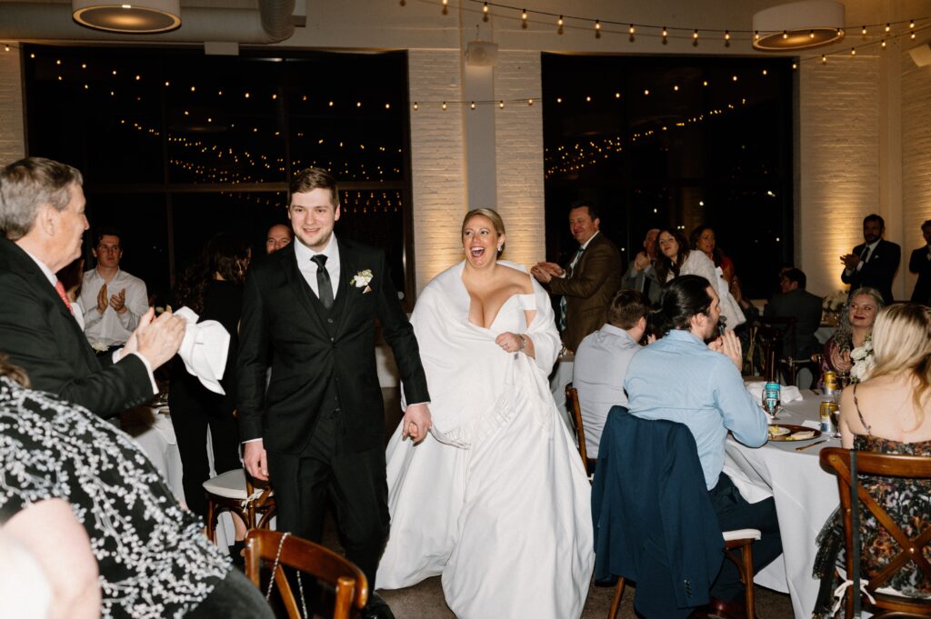 couple grand entrance at winter Urban Daisy wedding