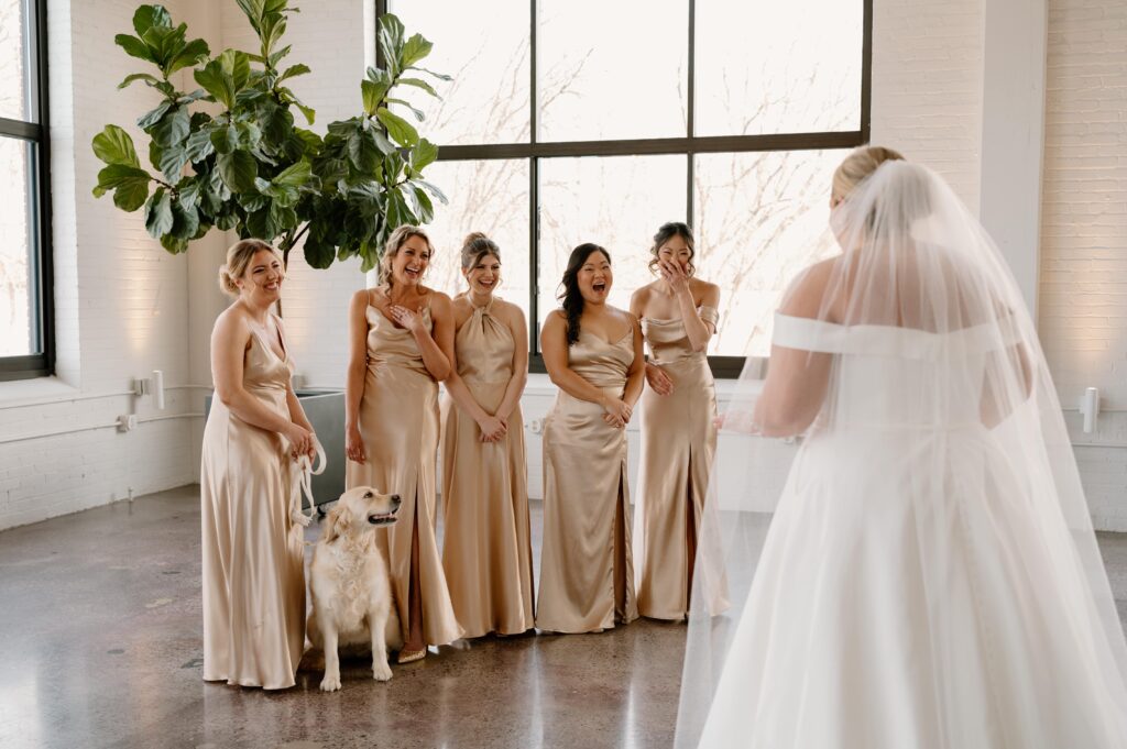 bridesmaid reactions during first look with bride