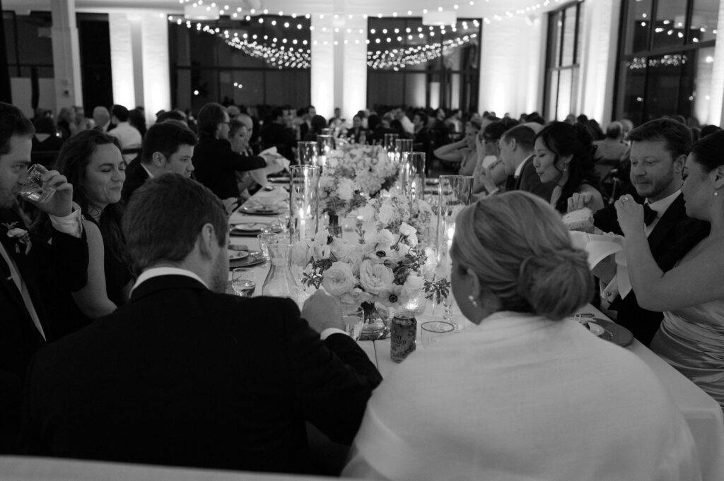 couple enjoying dinner with guests at reception