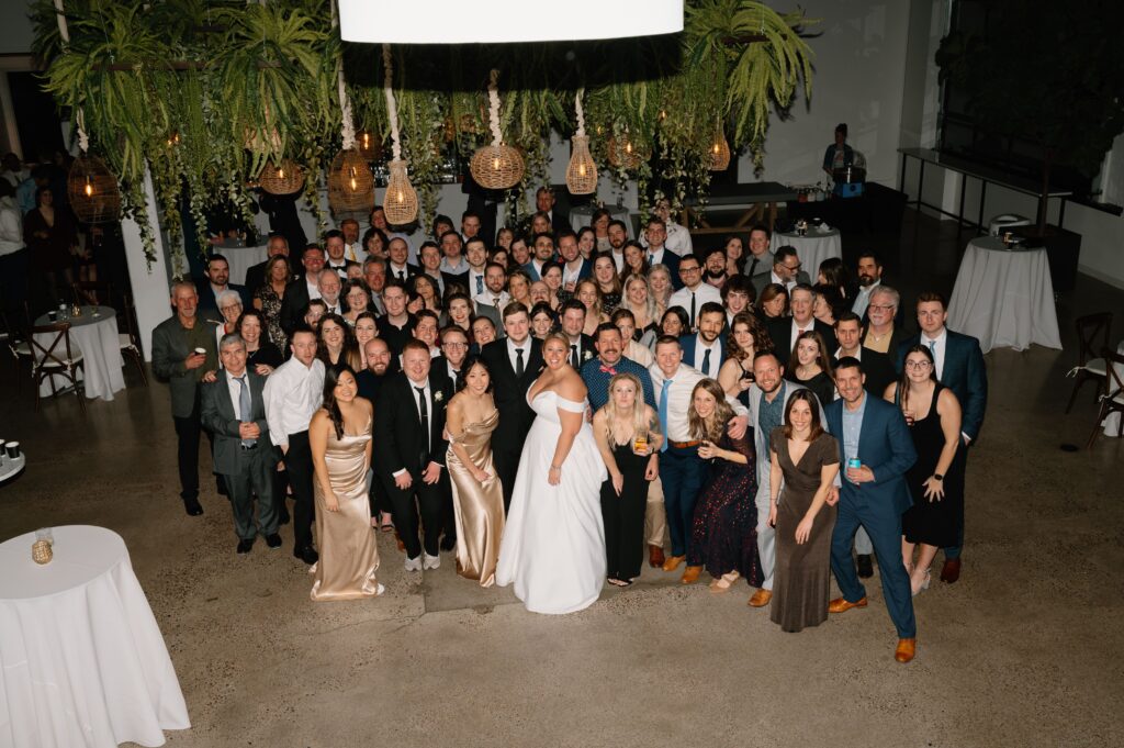 large group photo with guests at winter wedding