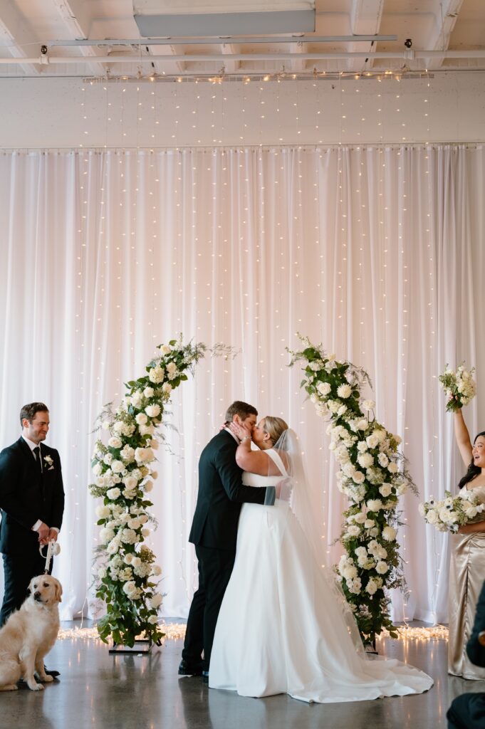 ceremony kiss at winter Urban Daisy wedding