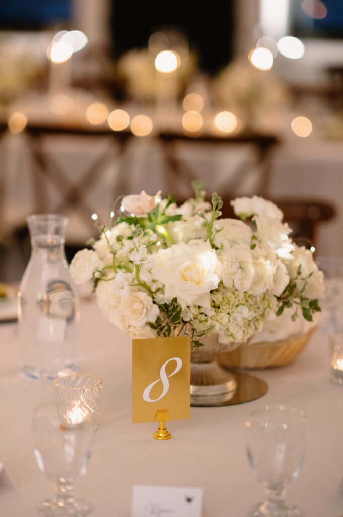 white floral centerpiece with twinkle lights